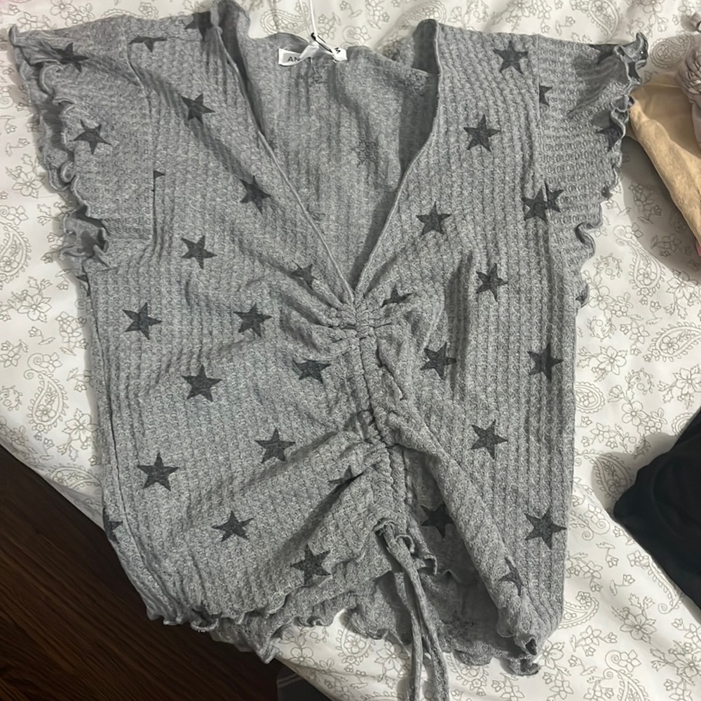 Antistar Grey Dressy Shirt with string adjusting stomach and had stars on it!